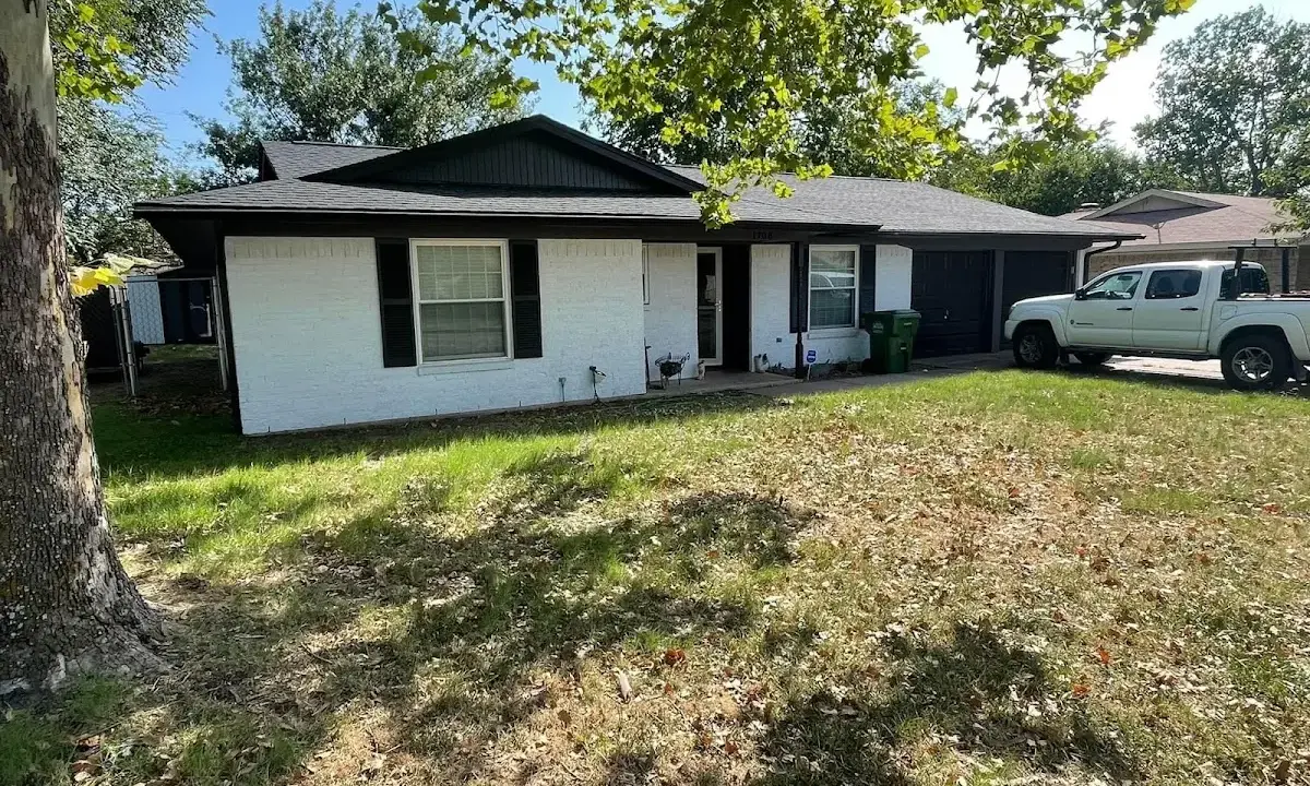Professional roofing crew working on a residential roof in North Chicago